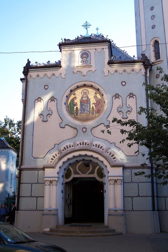 Façade of the Blue Church in Bratislava with its entrance and mosaic