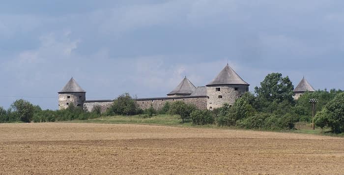 The fortified abbey of Bzovík seen from the surrounding countryside