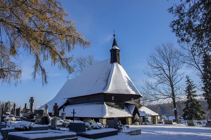 The Gothic wooden Church of All Saints with its shingled roof